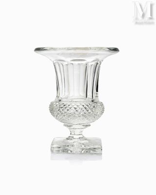 a glass vase that is sitting on a table