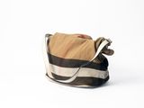 beige and black checkered purse on a white background