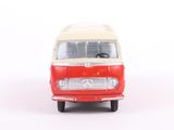 a small red and white bus on a white surface