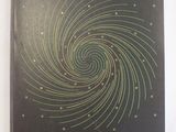 a black book with a spiral design on it