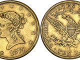 a gold coin with the head of a woman and an eagle on it