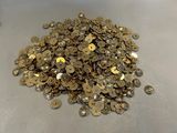 a pile of gold coins sitting on a table