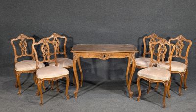 four chairs and a table with a wooden table and four chairs