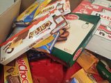 a box full of assorted snacks sitting on a table