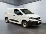 the white van is parked in a large room with a gray floor