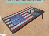 a cornhole with a flag on it on a table