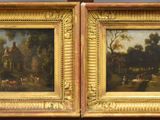 two paintings of a landscape are hanging on a wall