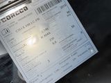 a person that is holding a ticket in their hand