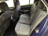 the back seats of a blue car are clean and ready to be used