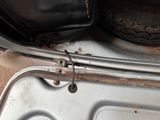 a close up of a car door handle and a tire