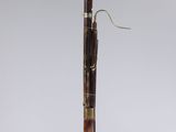 a pen with a wooden handle on a clear base