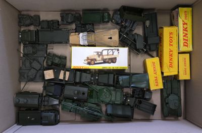 a box full of toy army vehicles and other items