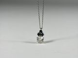 a white gold necklace with black and white diamonds on a chain