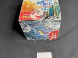 a small box with a sticker on it sitting on a table