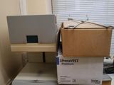 a box on top of a table with a laptop on it