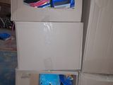 cardboard boxes stacked on top of each other in a room
