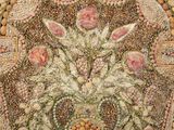 a picture of a mosaic of flowers and stones