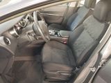 the interior of a car with a steering wheel and seat covers