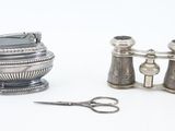 a pair of binoculars and a pair of scissors on a table