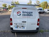 a white van that is parked in a parking lot
