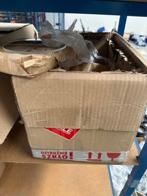 a cardboard box that is sitting on top of a shelf