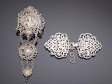 two pieces of silver jewelry including a broochet and earrings