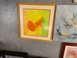 three paintings hanging on the wall next to each other
