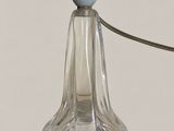 a glass lamp that has a cord attached to it