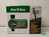 a box of rain bird garden timers sitting on a table