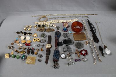 a lot of assorted jewelry on a table