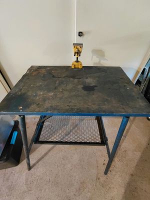 a small table with a metal top and a metal stand
