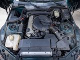 a car that has its hood open with the engine in it