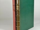 a green book with a red cover and a gold binding