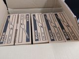 a cardboard box that has a bunch of scissors in it