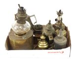 a box full of old brass objects on a white background