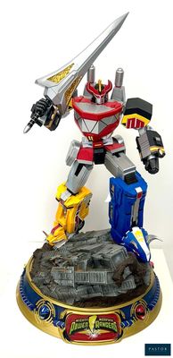a statue of a robot with a sword on top of a table