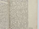 an open book with a black and white image of a cat