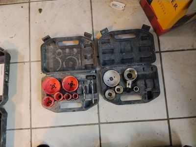 two tools that are sitting on the floor next to each other