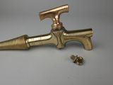 an old brass faucet with a screw and a screw