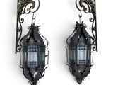 pair of antique wall sconces with glass panels and metal brackets