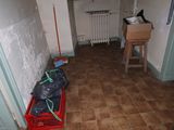 a red crate sitting in the middle of a hallway