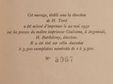an open book with a black and white image of a cat