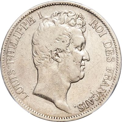 a close up of a coin with a man ' s face on it
