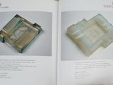 two pages of a book with a picture of a clock on it