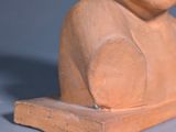a statue of a woman with a flower in her hair
