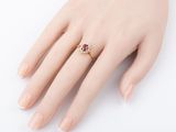 an image of a woman ' s hand with a ring on it ' s finger