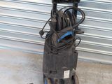 an image of a power washer with a hose and a spray can