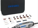 Un homme utilise la ponceuse filaire Dremel.