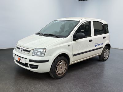 a small white car parked in a large room