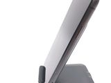 a cell phone that is sitting on top of a stand